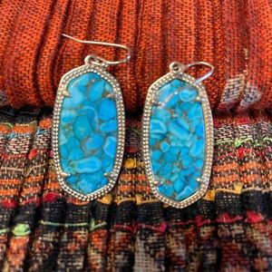 Kendra Scott Turquoise earrings with gold tone trim.